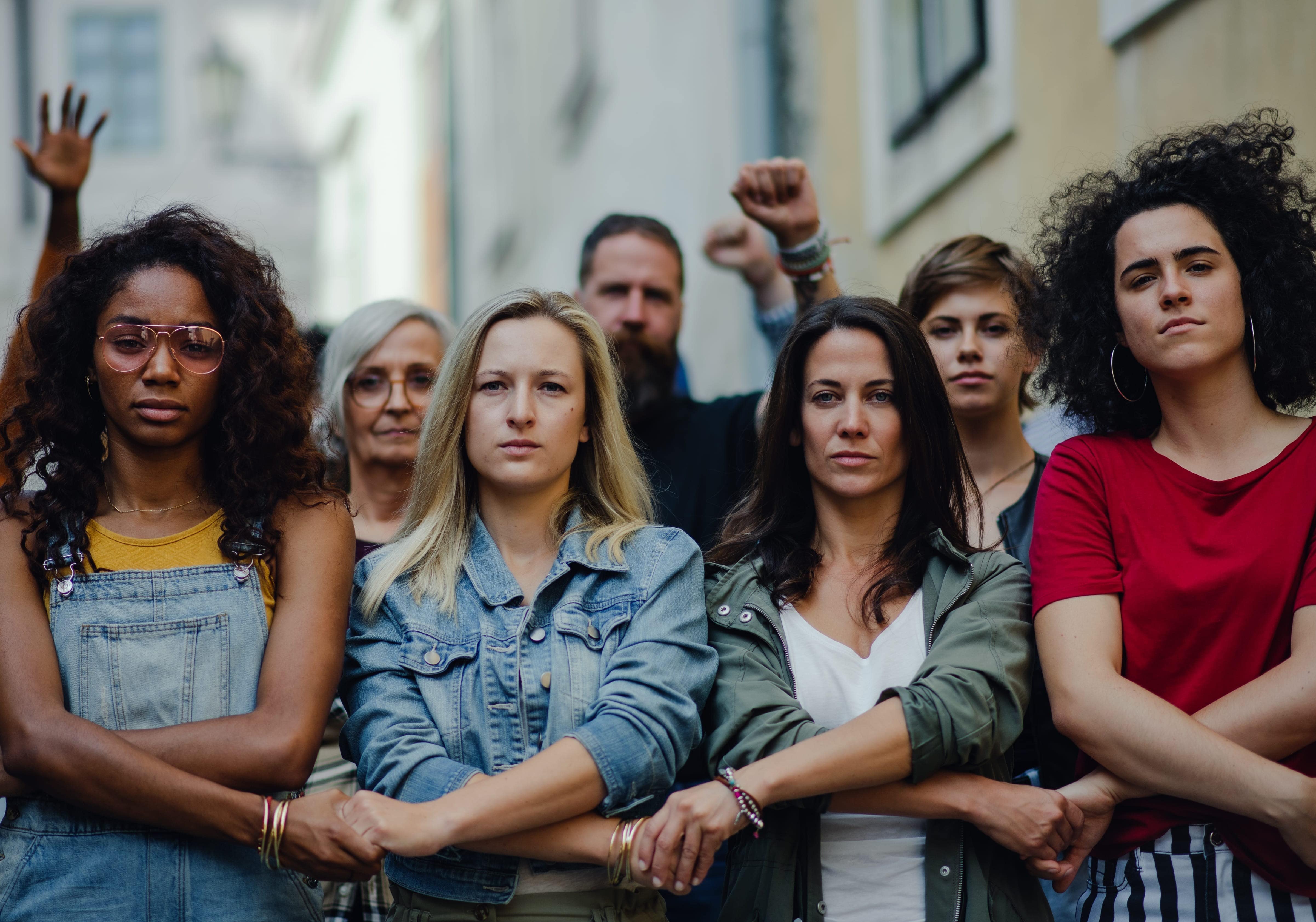 People arm in arm representing mental health advocacy